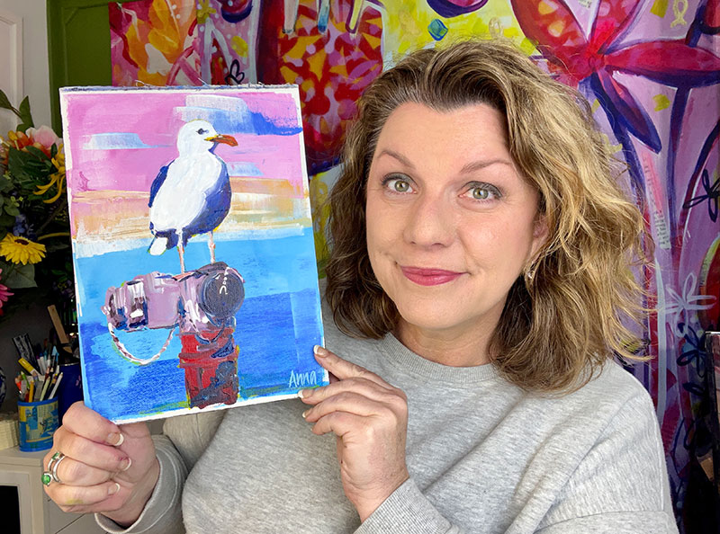 Anna holding 'Queen Barbara' painting