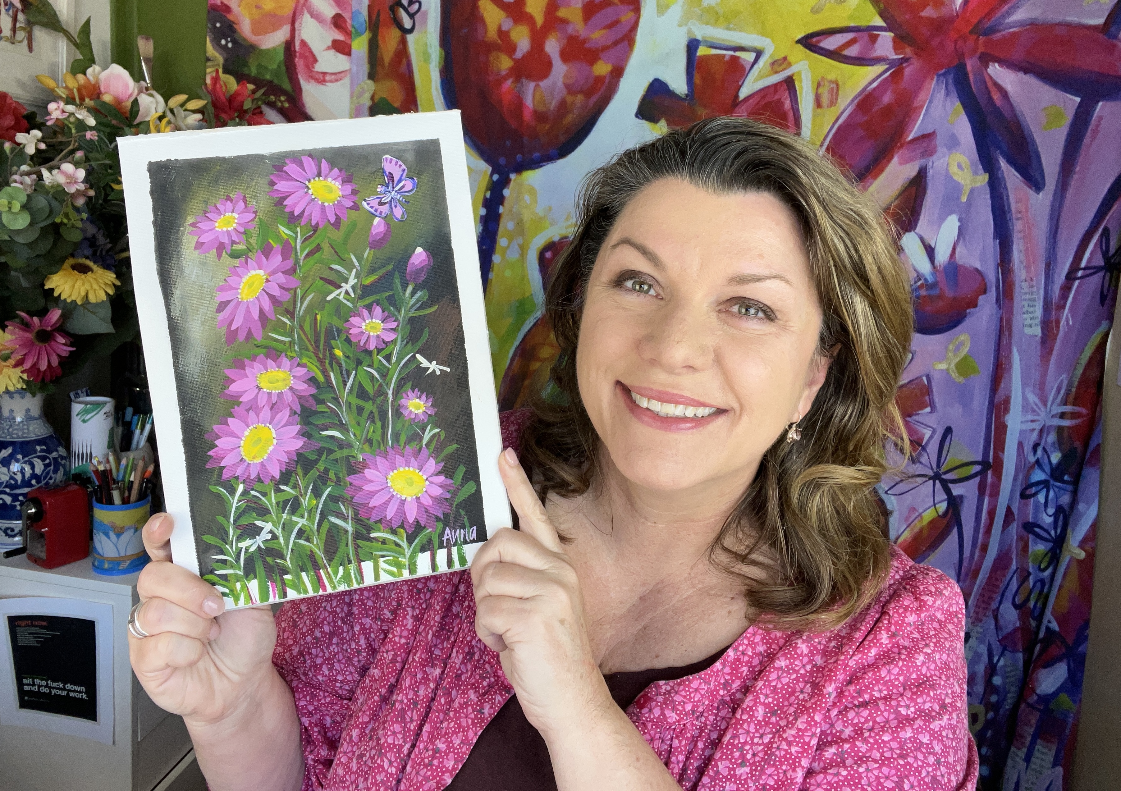 Anna holding 'Paris View' painting