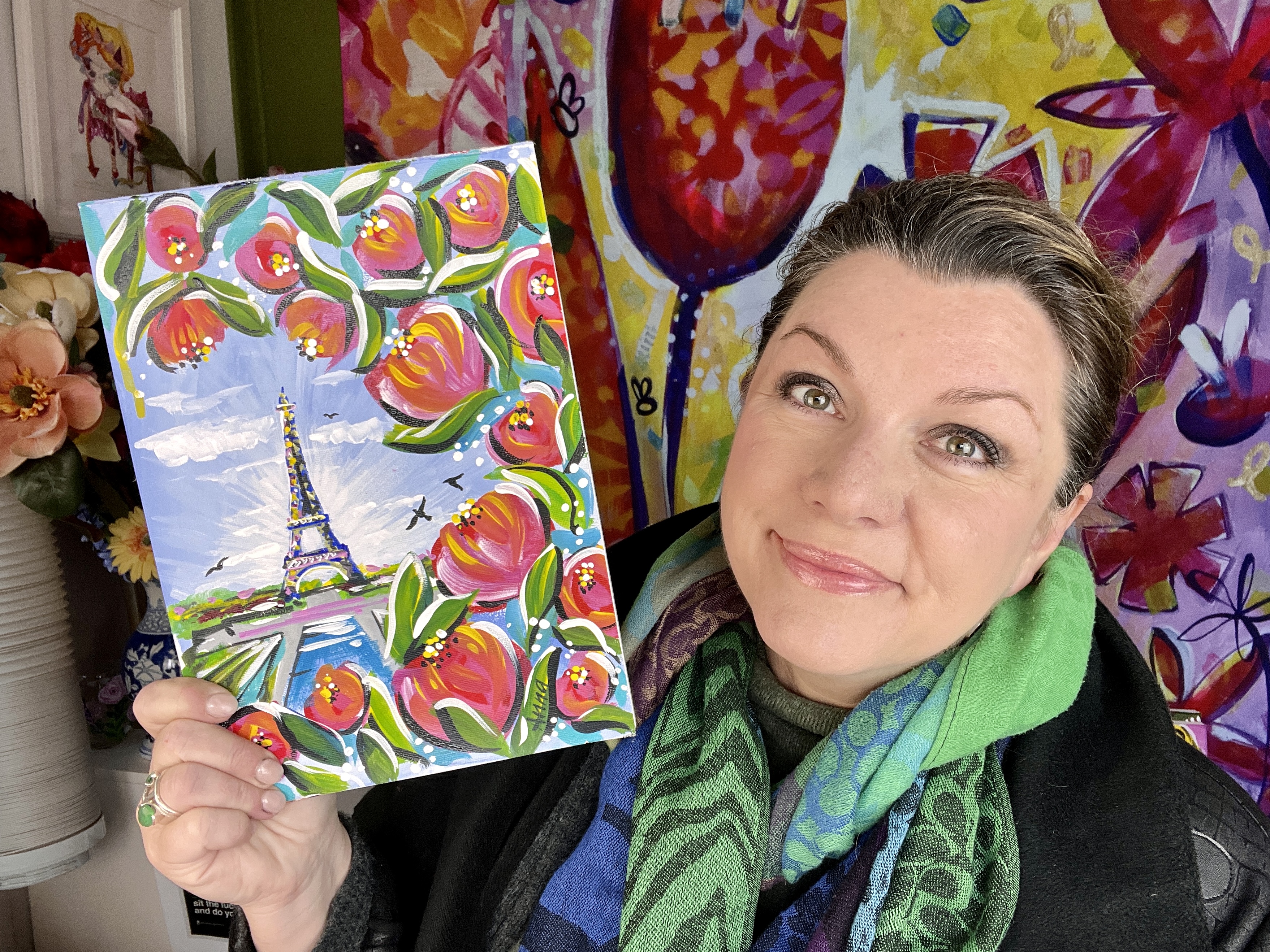 Anna holding 'Paris View' painting